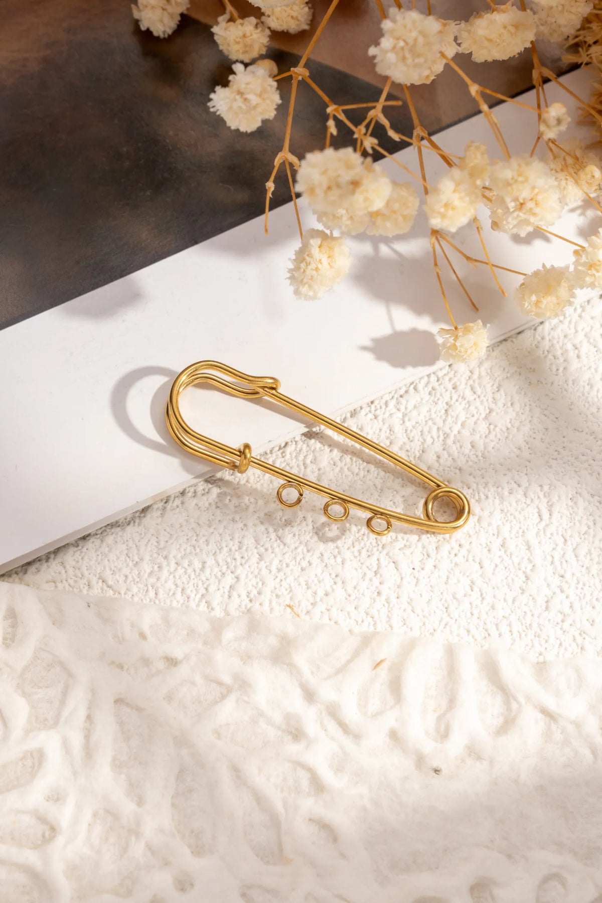 Broche à charms