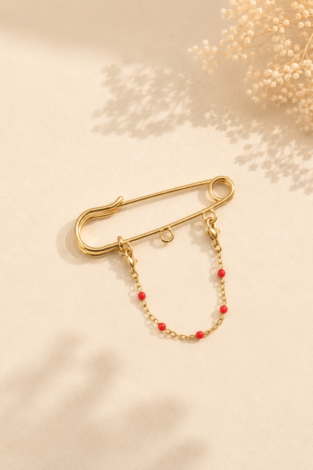 Chaîne pour broche perles rouge