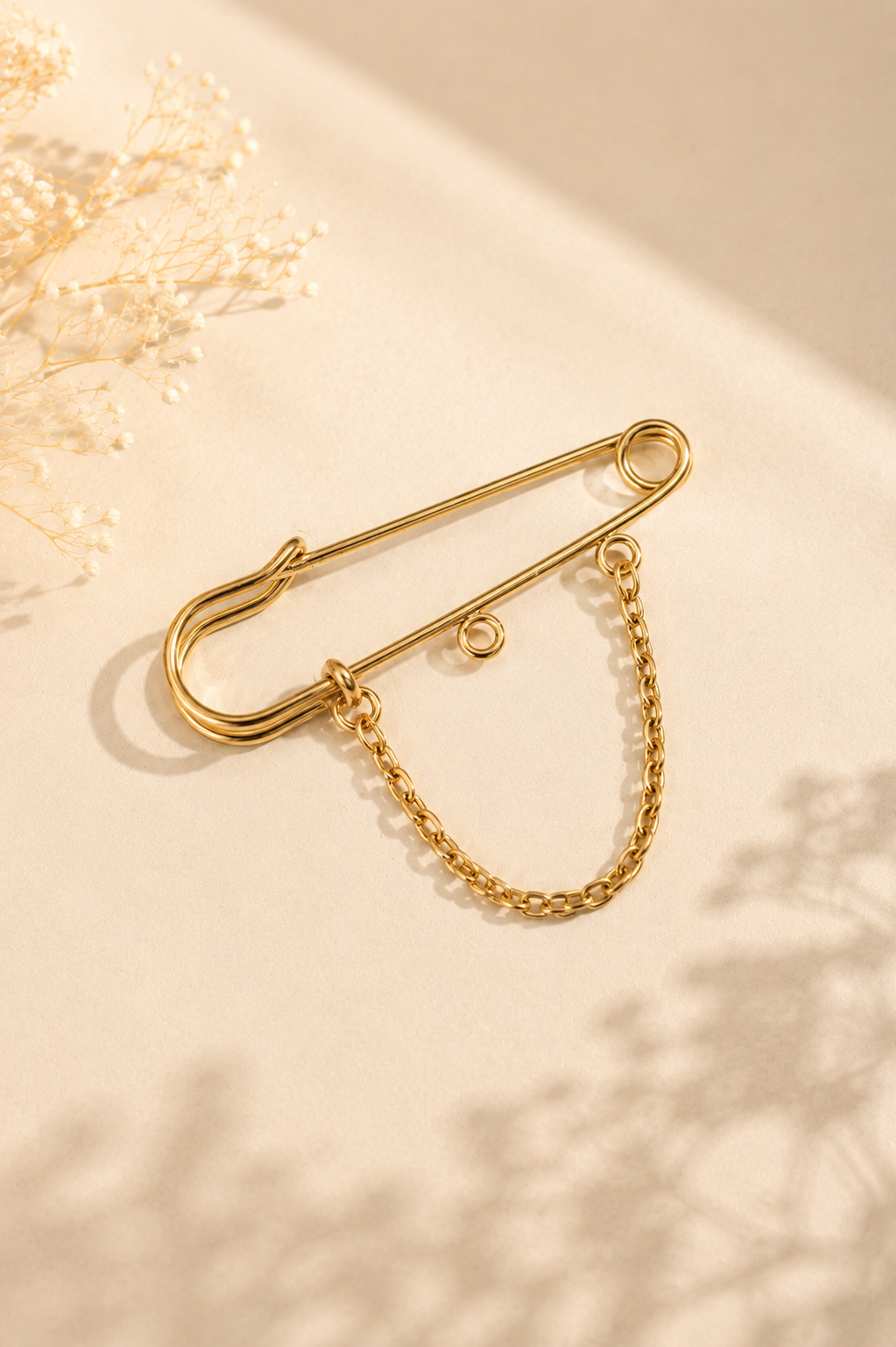 Chaîne pour broche doré